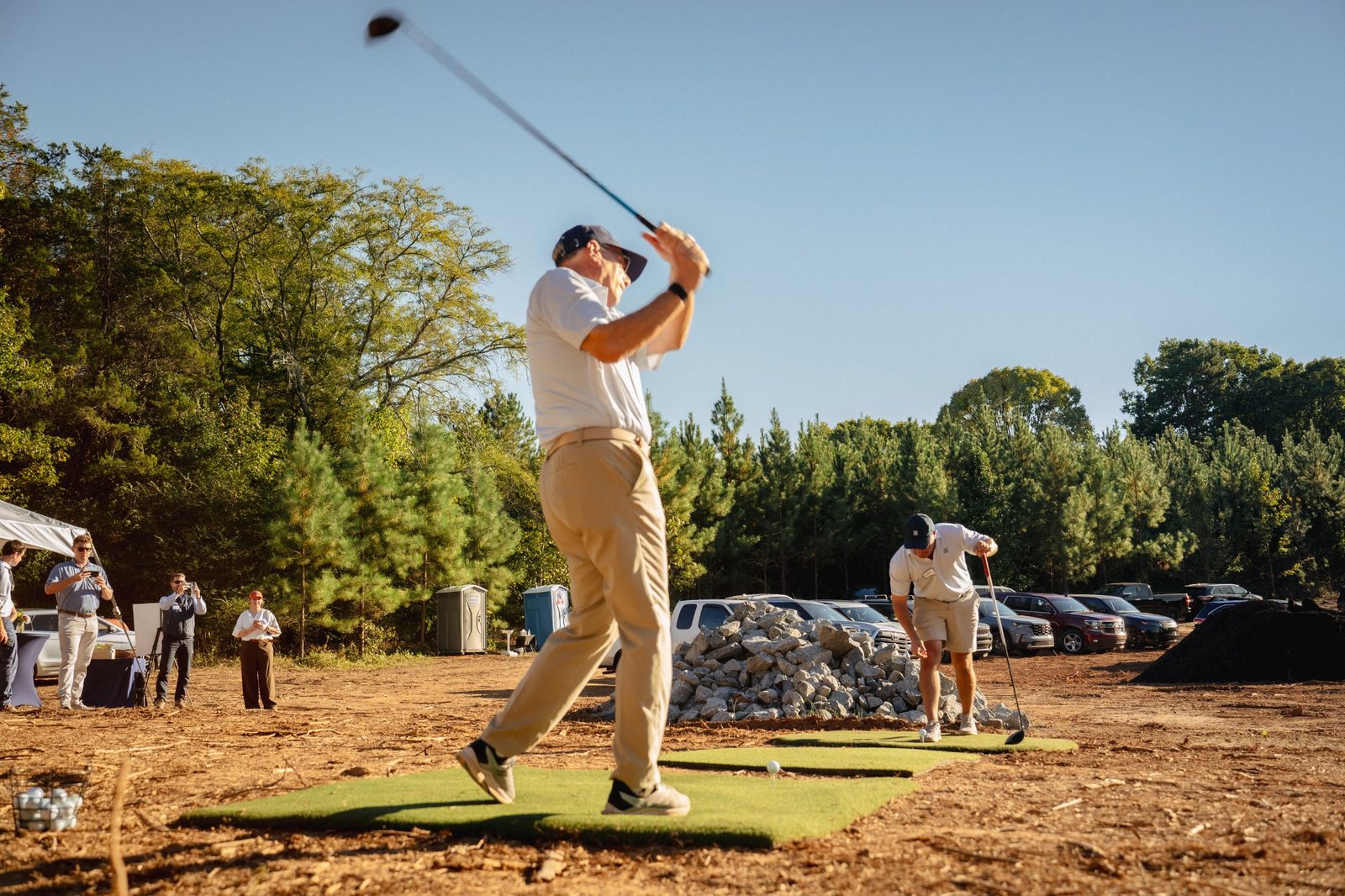 A ceremonial drive struck from a turf mat