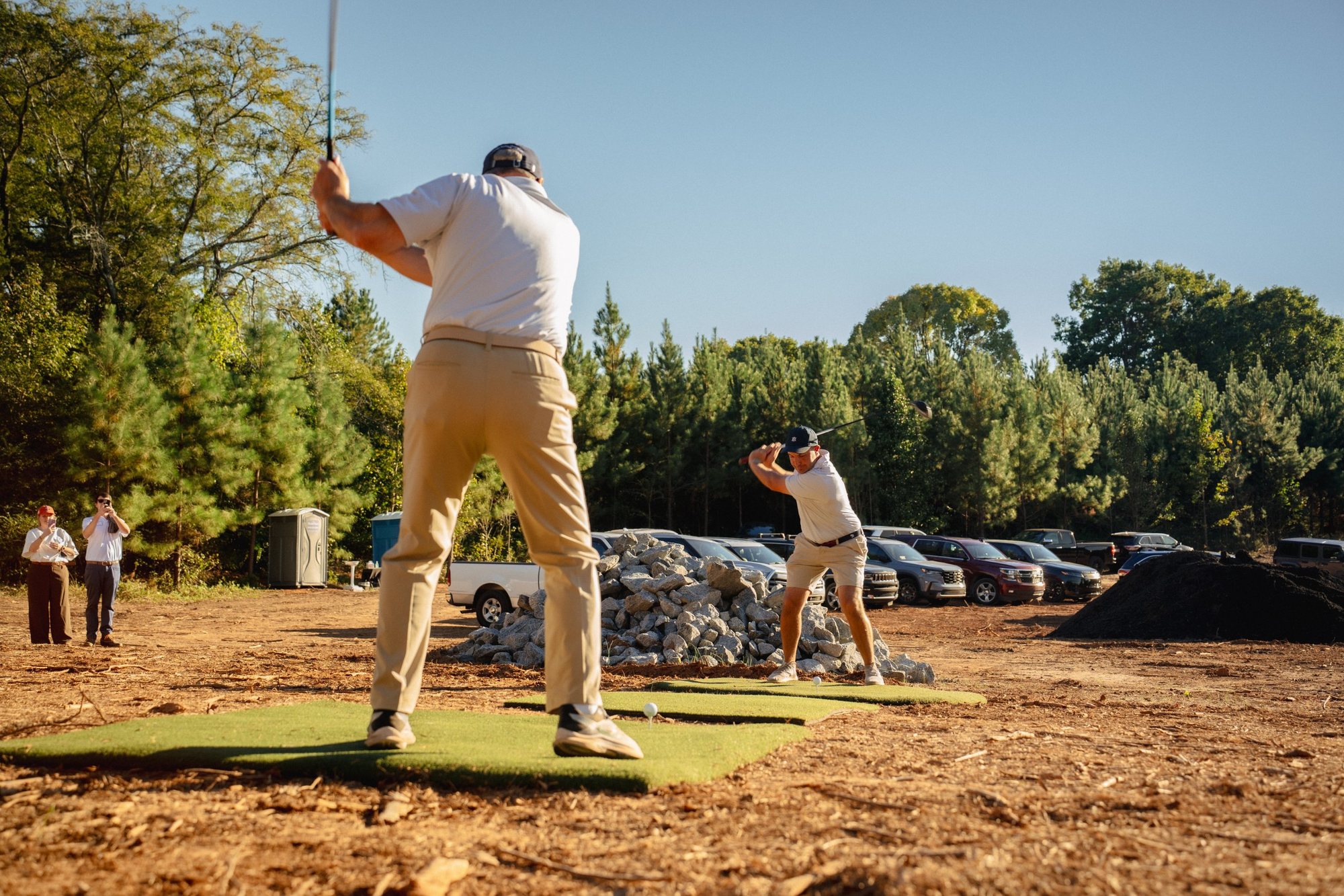 Phil and Scott Hamel striking the first ceremonial tee shots at High Side Golf Club