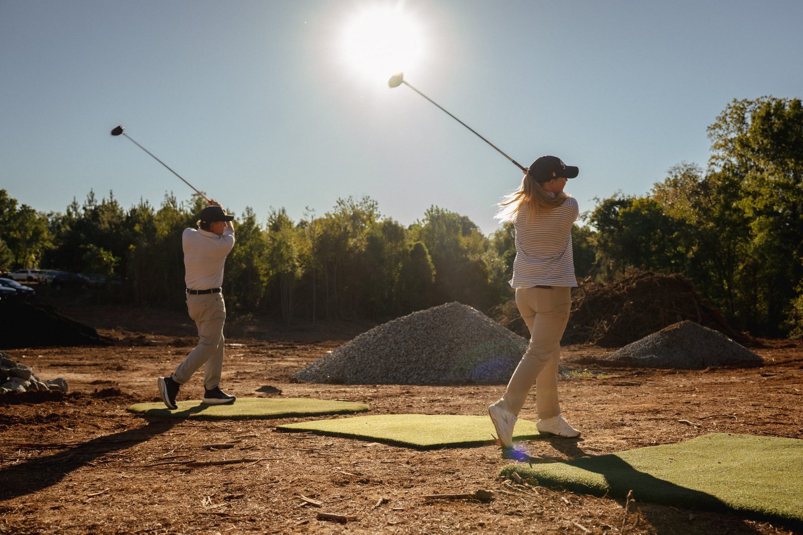 Two ceremonial tee shots struck at the same moment